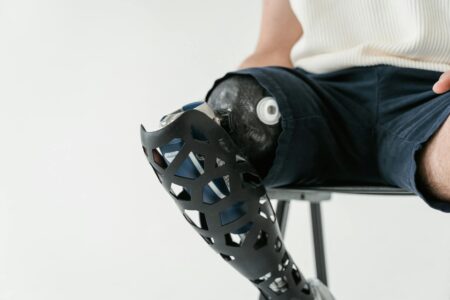 close up shot of a person sitting on a metal chair